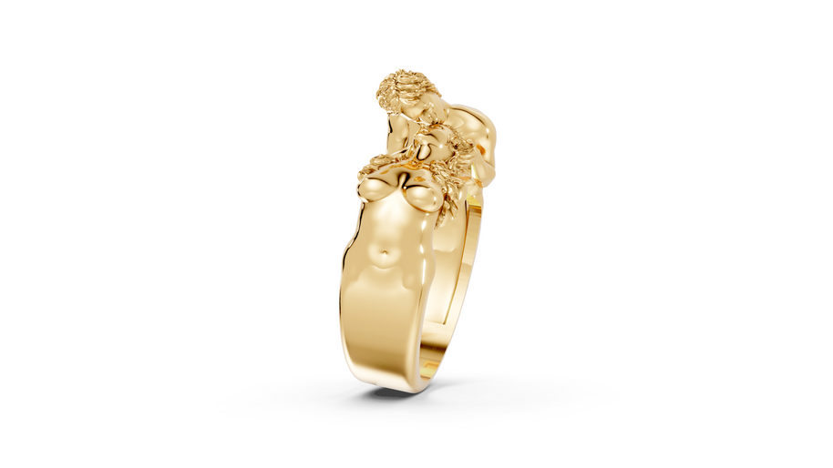 Gold ring with a lion head design on a white background