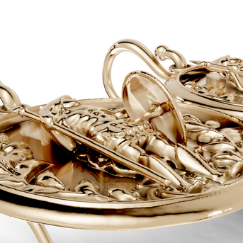 Gold pendant with intricate design on a white background