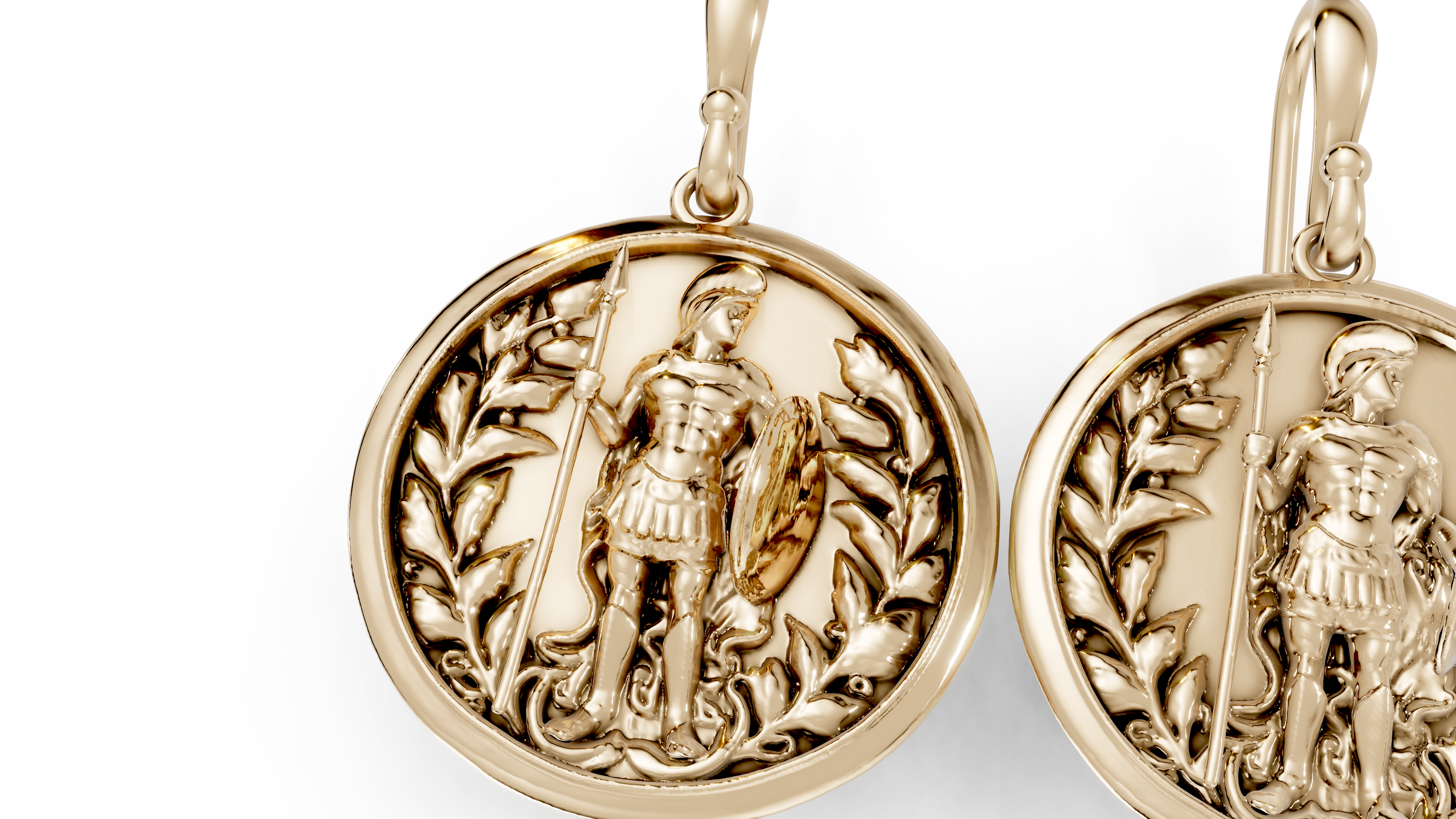 Gold earrings with intricate designs on a white background