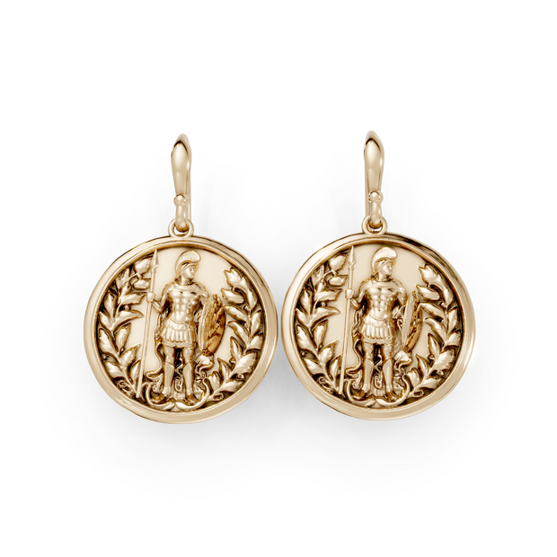 Gold earrings with detailed designs on a white background