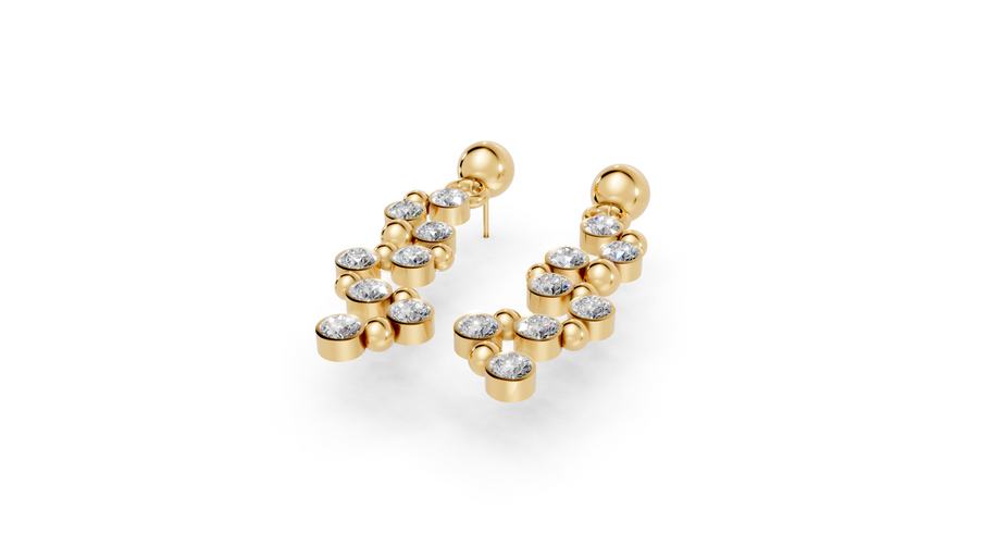 Gold earrings with clear gemstones on a white background
