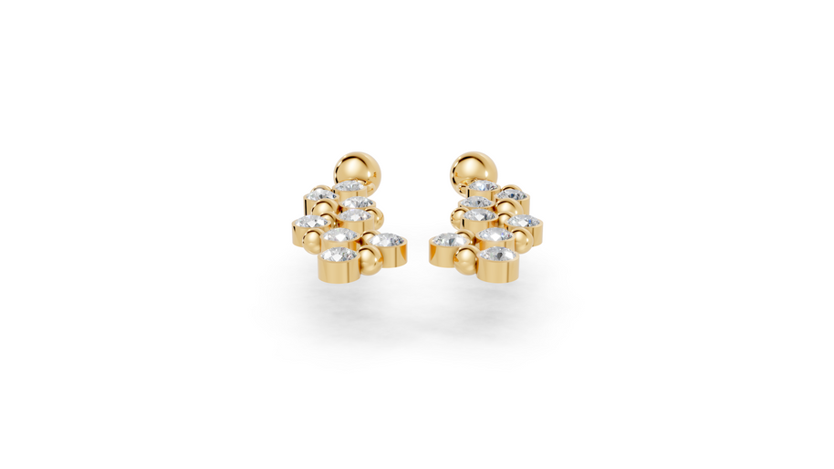Gold earrings with clear stones on a white background