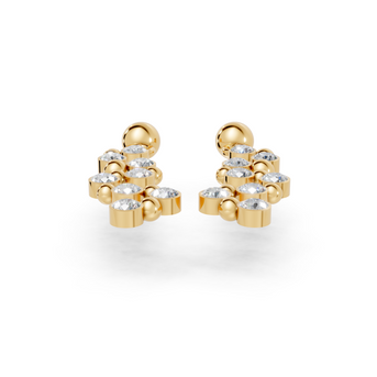 Gold earrings with clear stones on a white background