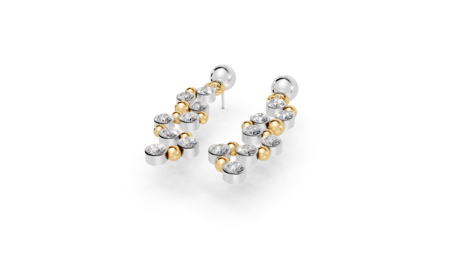 Pair of gold and silver hoop earrings on a white background