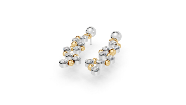 Pair of gold and silver hoop earrings on a white background