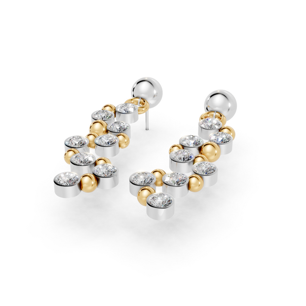 Pair of gold and silver hoop earrings on a white background