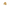 Gold skull-shaped ring on a white background