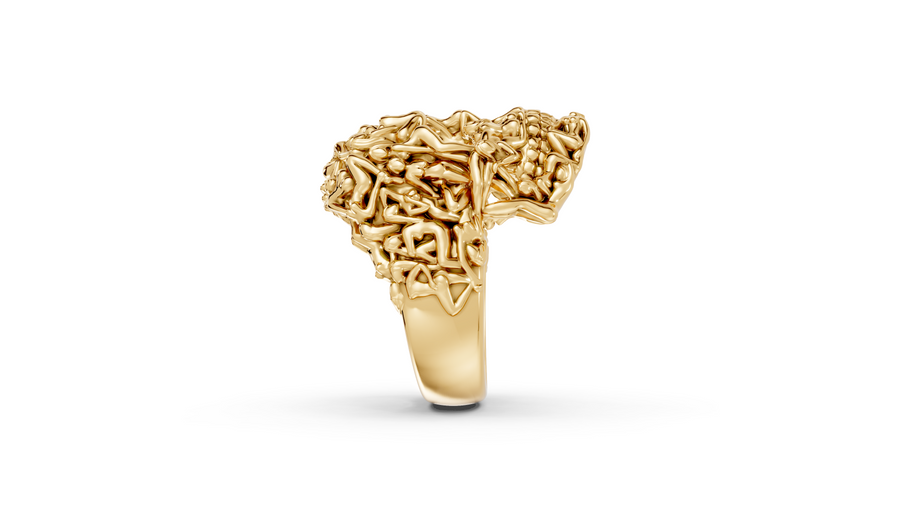 Gold ring with intricate design on a white background