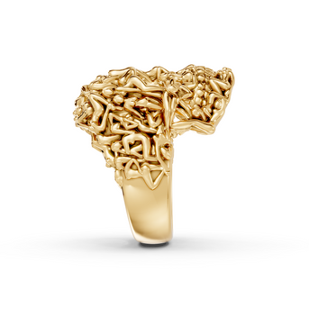Gold ring with intricate design on a white background