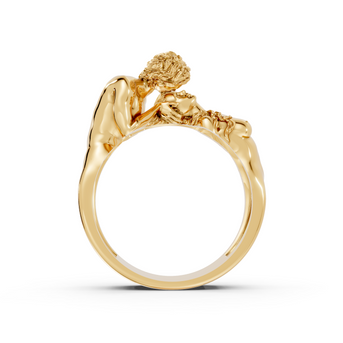 Gold ring with a detailed design on a white background