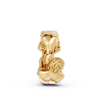 Gold charm with a unique design on a white background