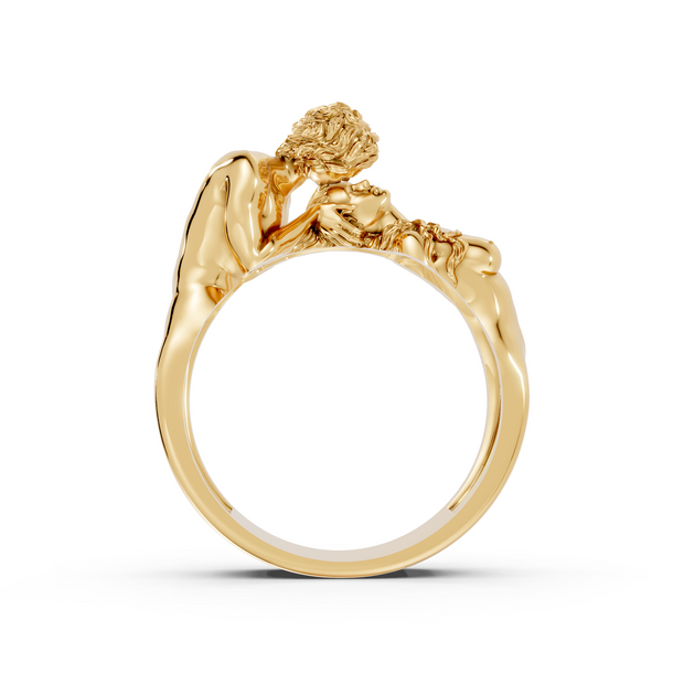 Gold ring with a detailed design on a white background