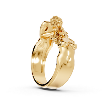 Gold ring with a decorative design on a white background