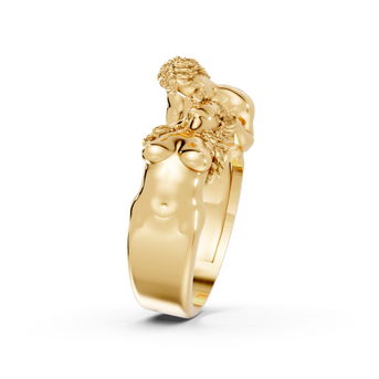 Gold ring with a lion head design on a white background
