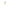 Gold ring with a green gemstone on a white background