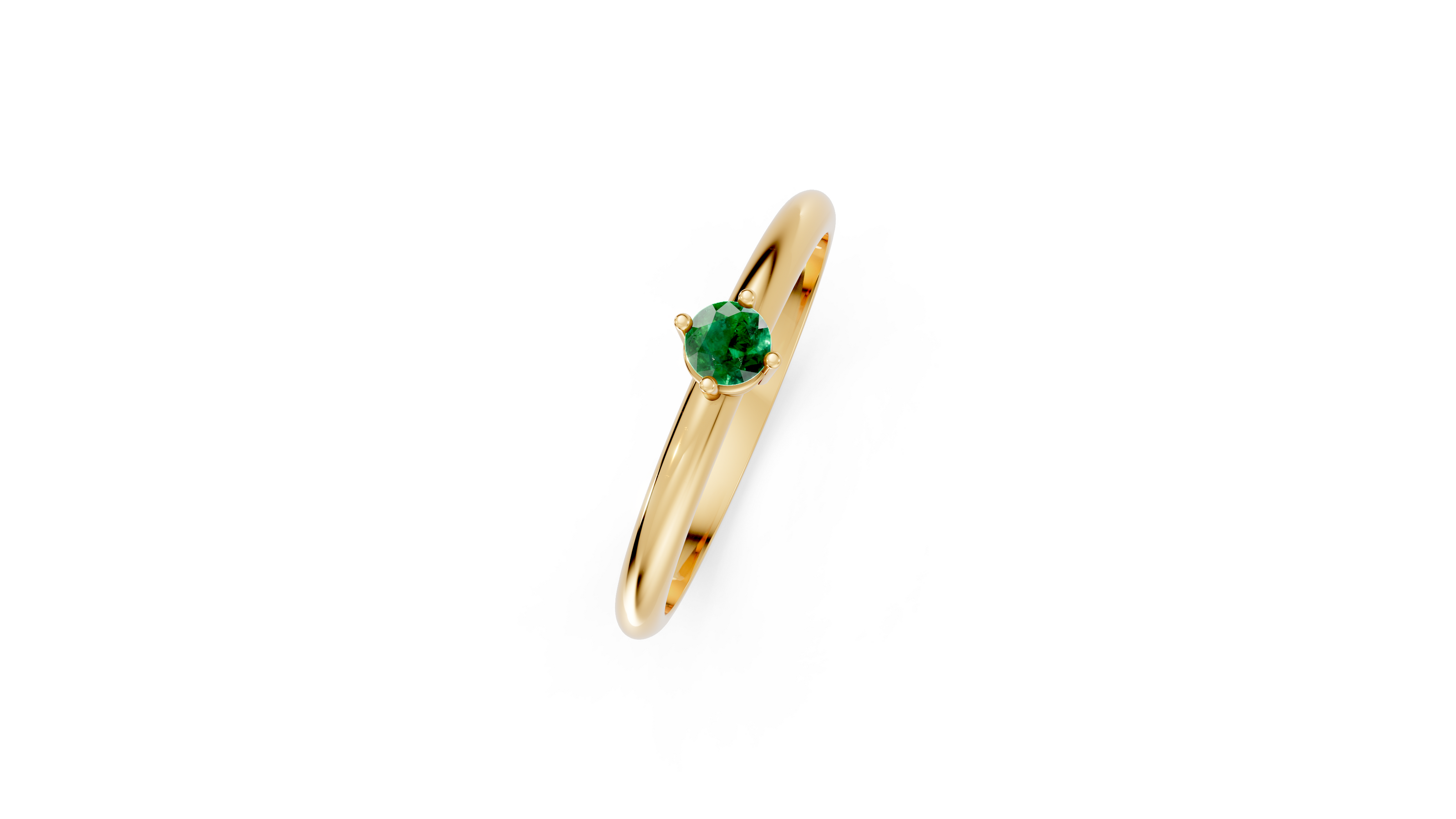 Gold ring with a green gemstone on a white background