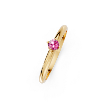 Gold ring with a pink gemstone on a white background