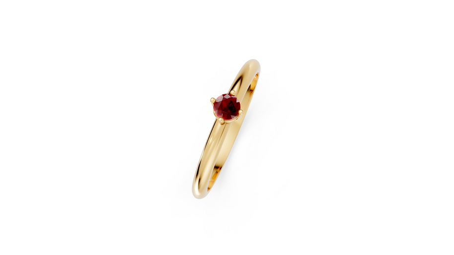 Gold ring with a red gemstone on a white background