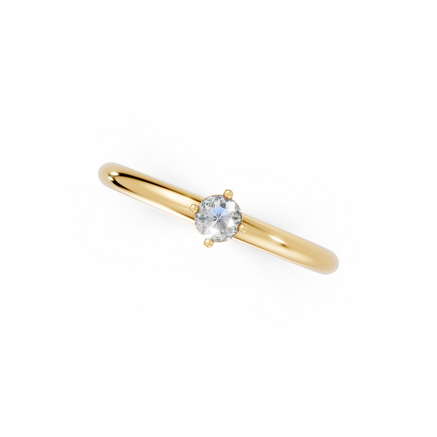 Gold ring with a diamond on a white background