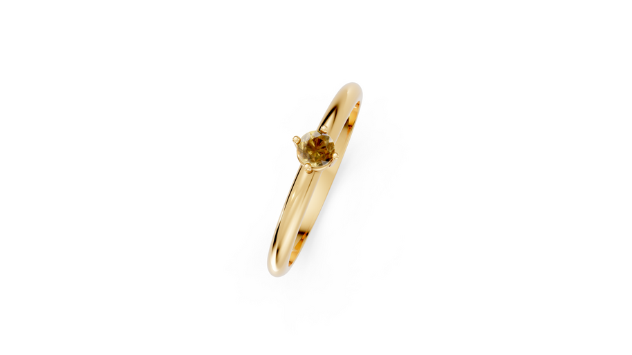 Gold ring with a small gemstone on a white background
