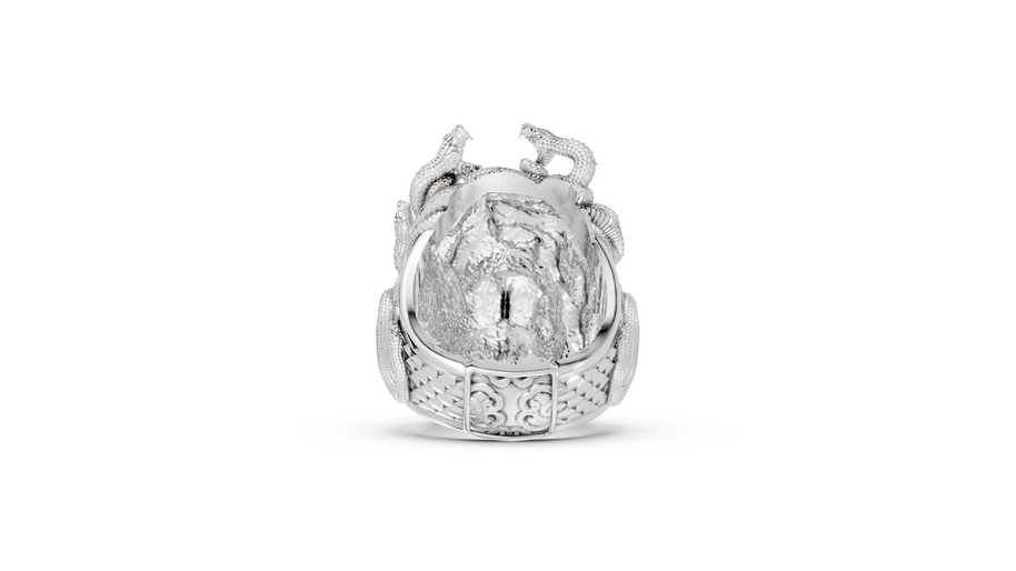 Silver ring with intricate design on a white background