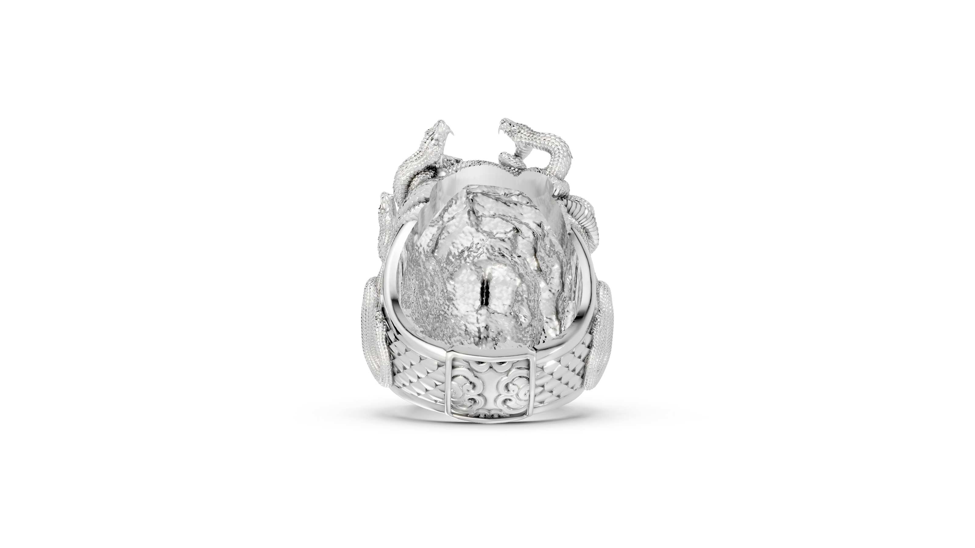 Silver ring with intricate design on a white background