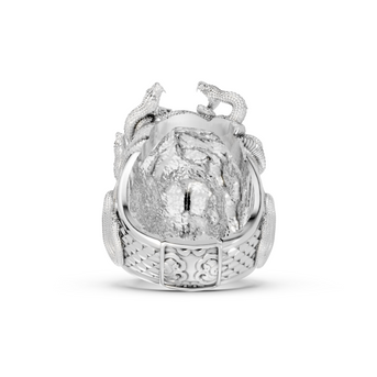 Silver ring with intricate design on a white background