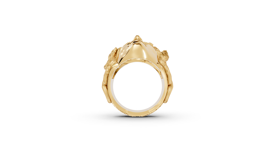 Gold ring with a detailed design on a white background