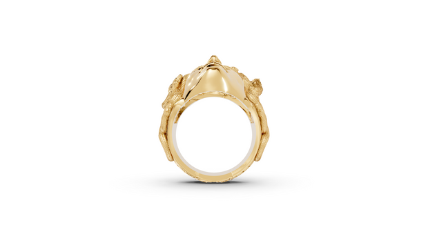 Gold ring with a detailed design on a white background