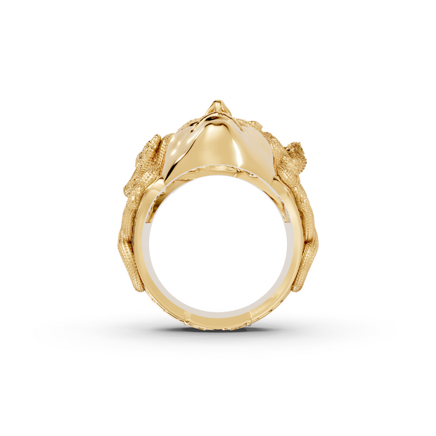 Gold ring with a detailed design on a white background