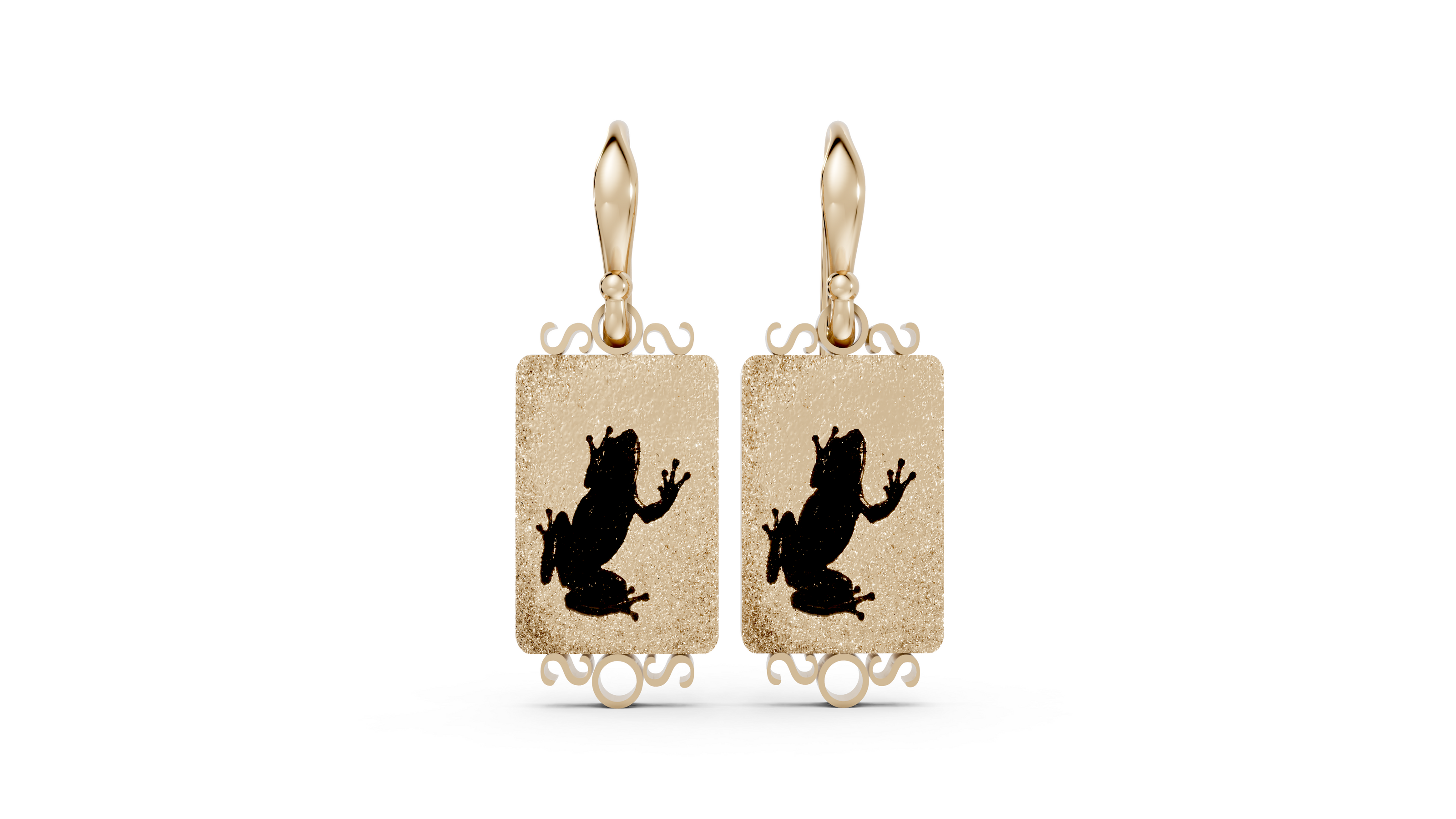 Gold earrings with black frog designs on a white background
