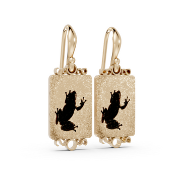 Gold earrings with black silhouette design on a white background