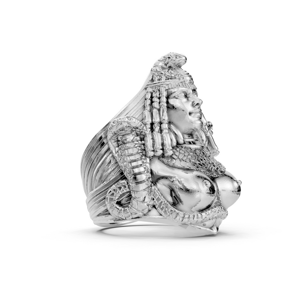 Silver ring with intricate design on a white background