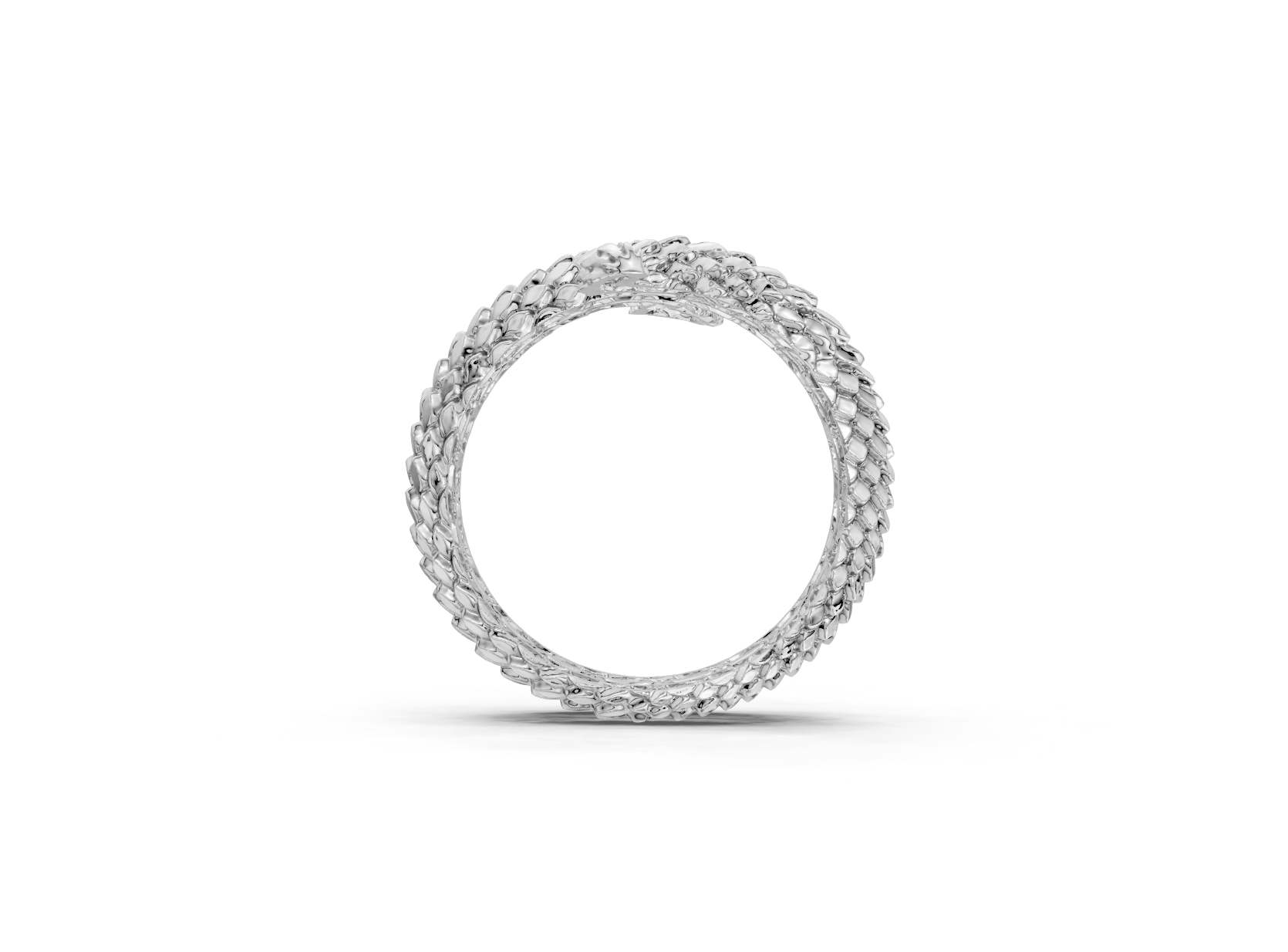 Silver ring with intricate design on a white background
