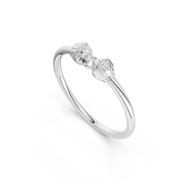 Silver ring with a small diamond on a white background