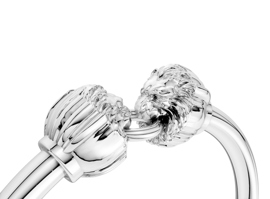 Close-up of a silver ring with a clear gemstone on a white background
