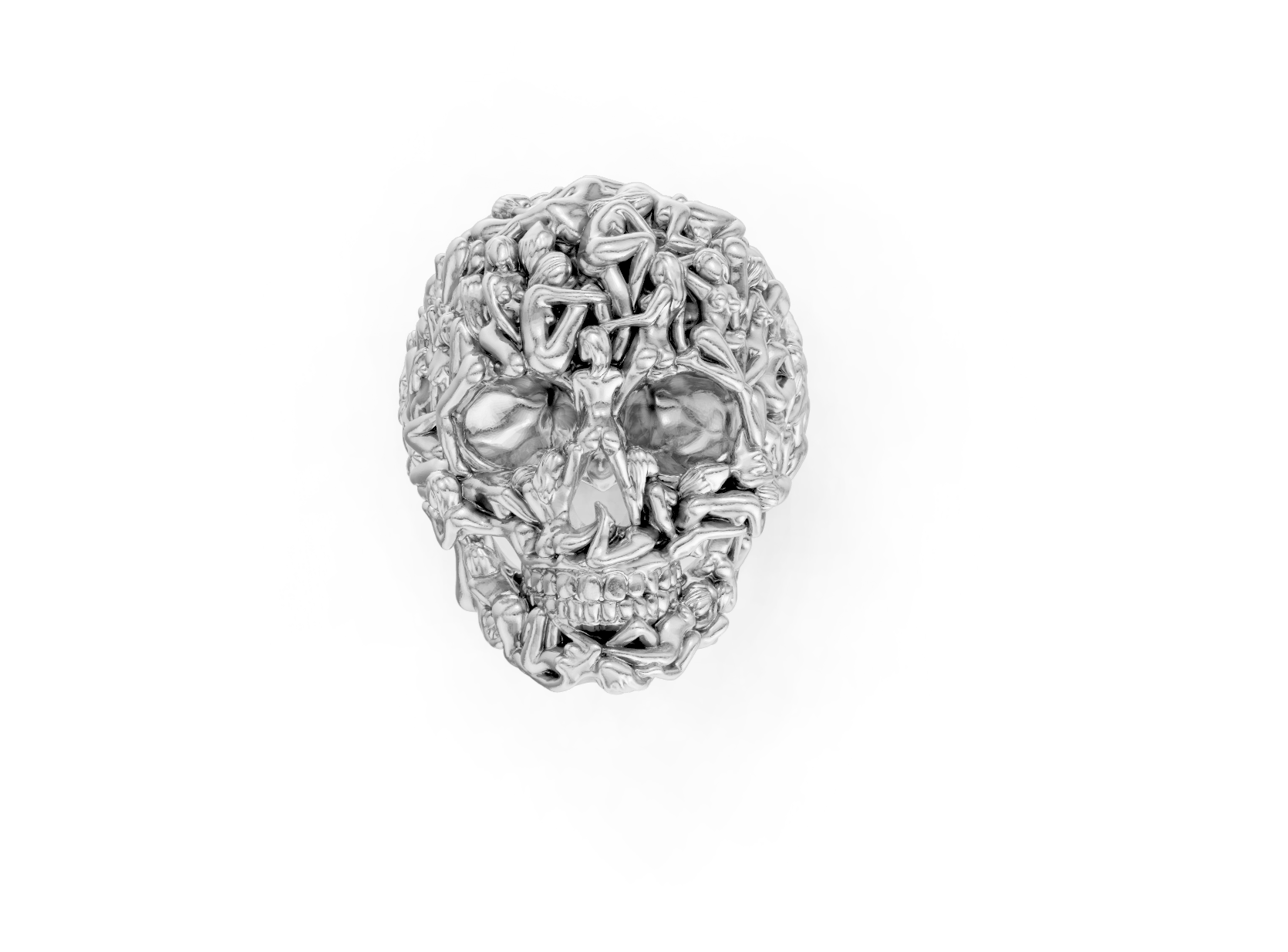 Silver skull-shaped pendant with intricate designs on a white background