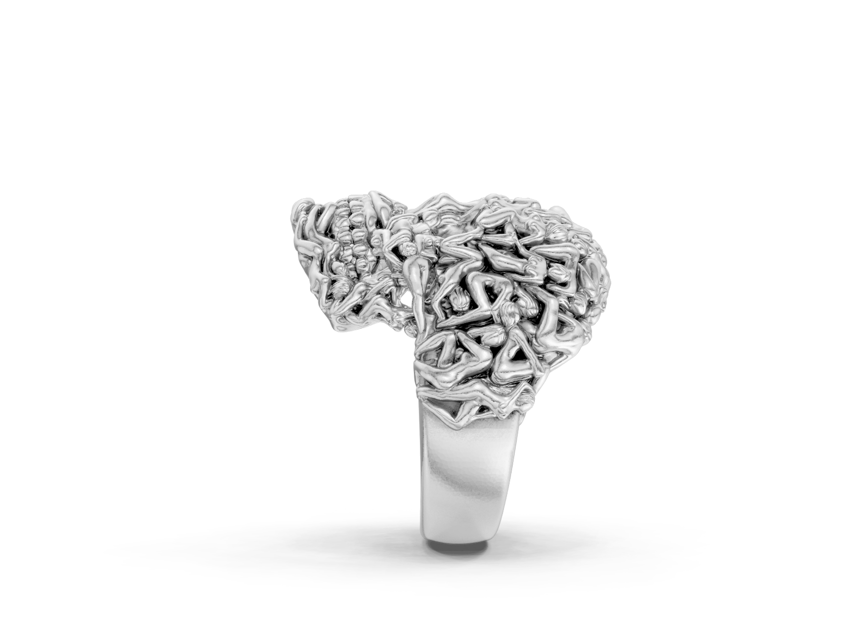 Silver ring with intricate design on a white background