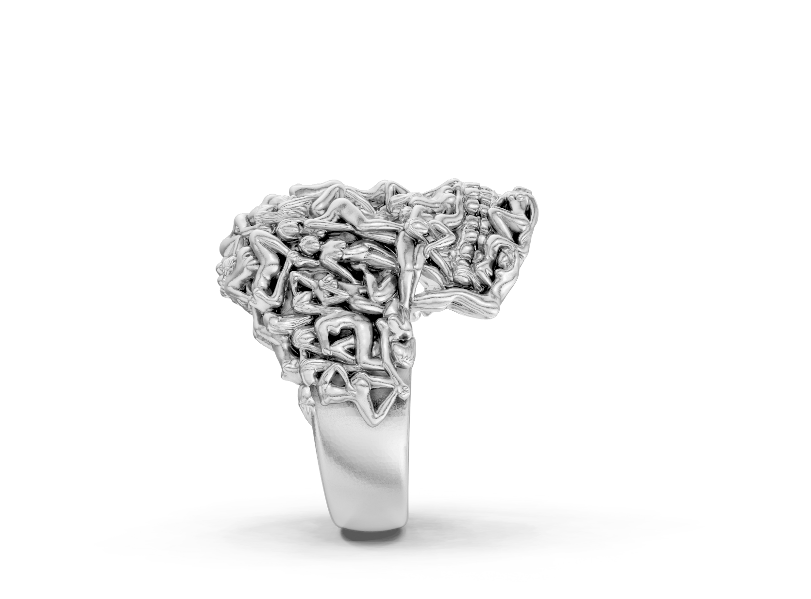 Silver ring with intricate design on a white background