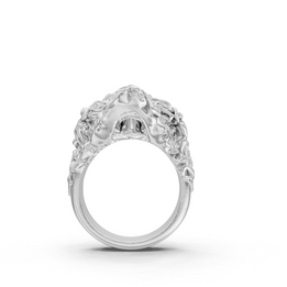 Silver ring with intricate design on a white background