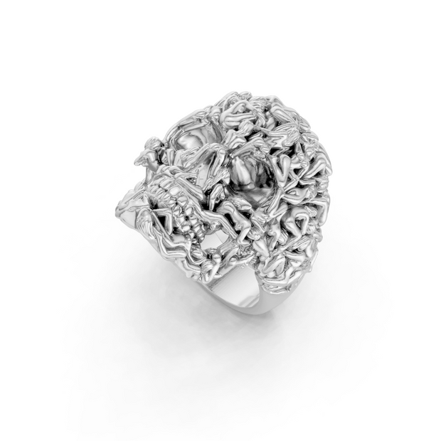 Silver ring with intricate design on a white background