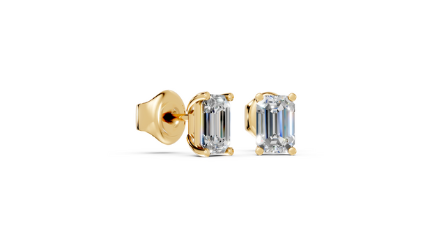 emerald studs front and angled in yellow gold