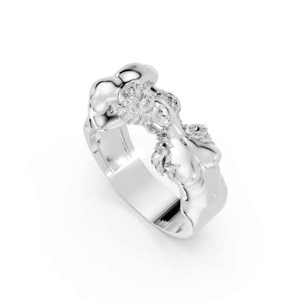 Silver ring with intricate design on a white background