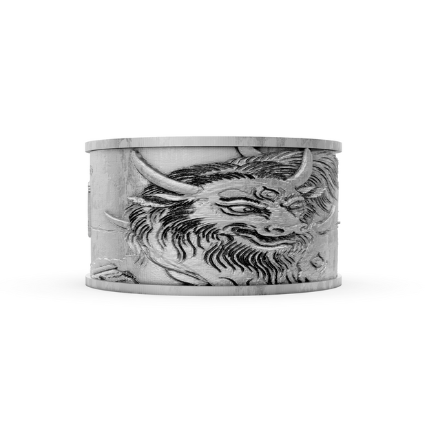 Silver cuff bracelet with dragon design on a white background