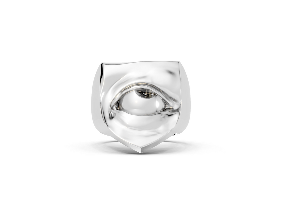 Silver ring with a unique design on a white background