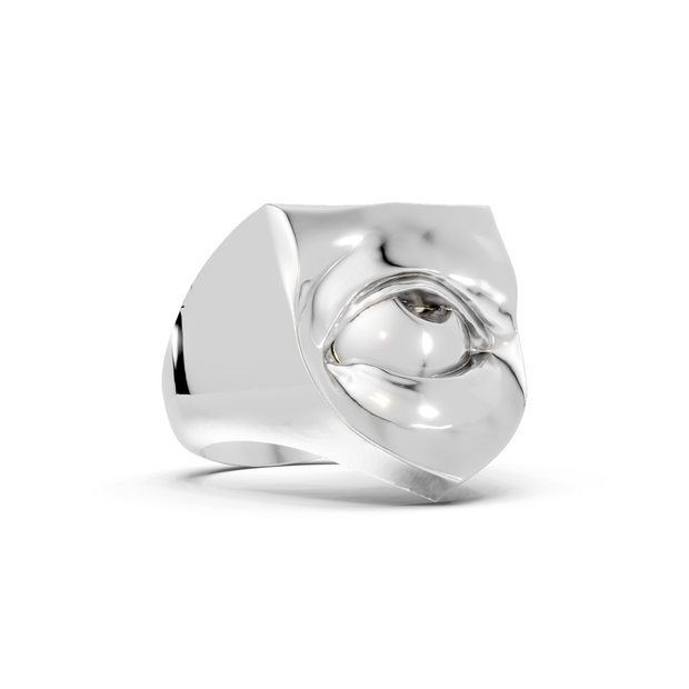 Silver ring with a heart design on a white background