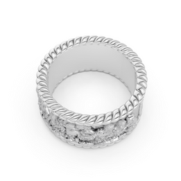 Silver ring with intricate design on a white background