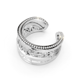 Silver ring with intricate design on a white background