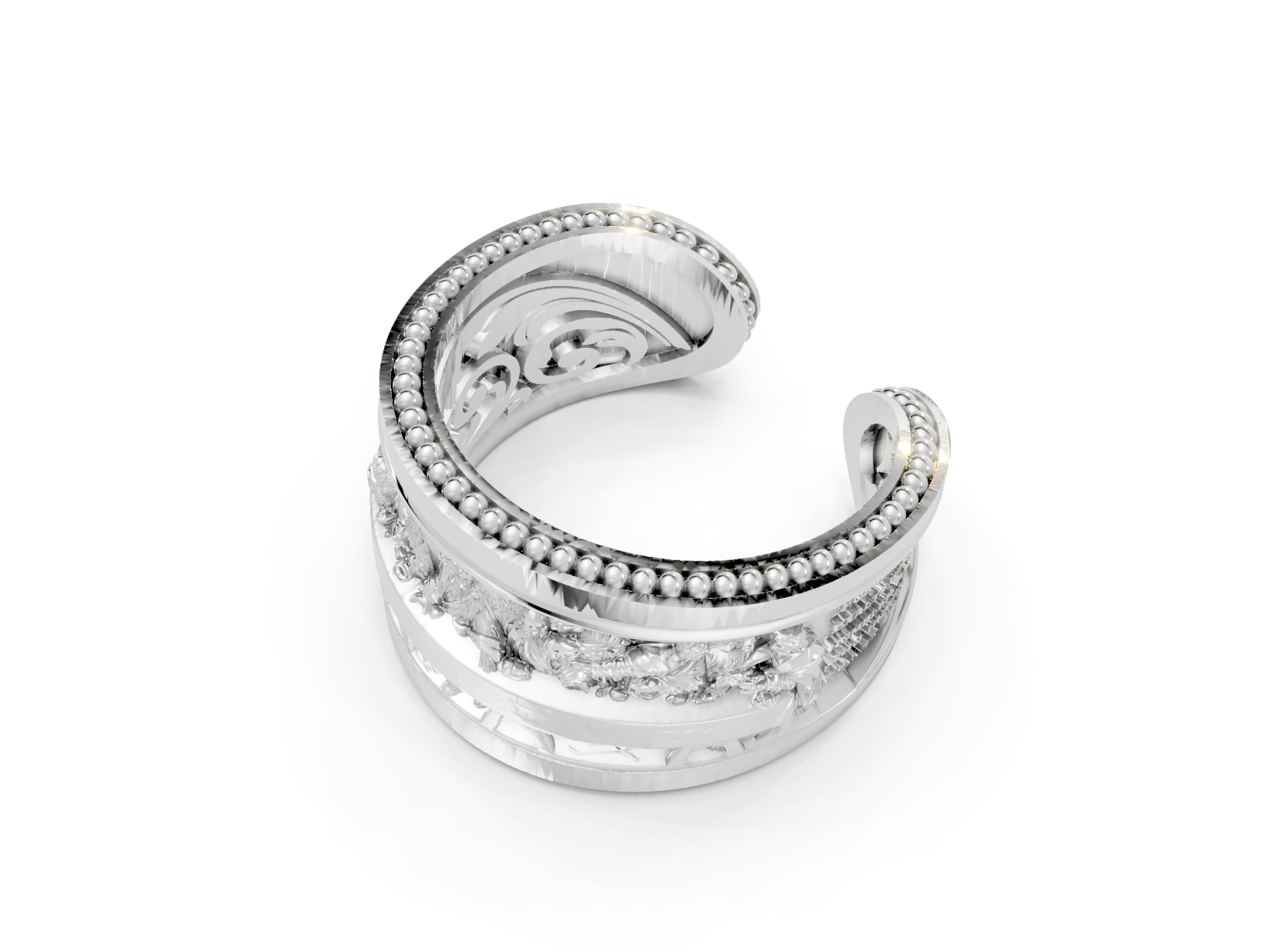 Silver ring with intricate design on a white background