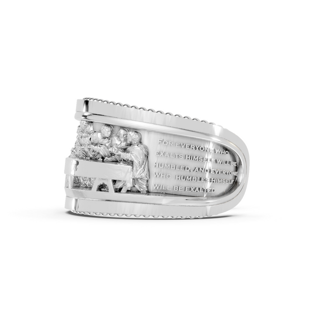 Silver ring with engraved text on a white background